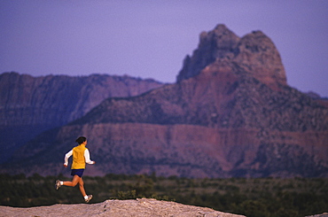 Talyn Villasenor runs on slickrock at Gooseberry Mesa in Southern Utah.