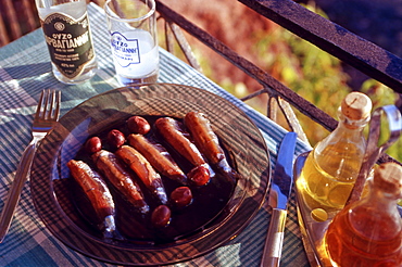 Lesvos. Greece. Sigri. Locally made Ouzo (Babayiannis) and Sardine speciality called Sardeles Pastes.