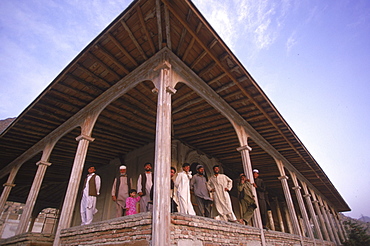 Workers pause by the columns of a 19th century summer pavilion in the Babur Gardens, or Bagh-i-Babur, Kabul, Afghanistan, September 25, 2002. The pavilion, which was used as a restaurant in the 20th century, was built by  Amir Abdur Rahman, but was heavily damaged  by the  factional fighting of the mujihadeen in the 1990's  and later by the Taliban.  The  buildings and gardens are now being carefully restored.  Shah Babur, a descendent of Ghengis Khan and grandson of Tamerlane, is credited for founding the  great Moghul dynasty which ruled India for two centuries.  Babur  built the palace and created the gardens on a hill looking over the southern part of Kabul in the 16th century,