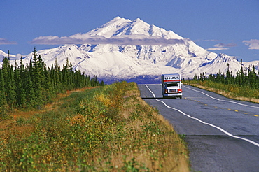 Alaska's Mt. Drum looms in the background as a U-Haul moving van drives along the Glenn Highway near Glennallen, Alaska.