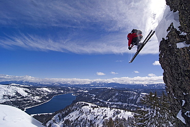 A man skiing off a cliff above Donner Lake California.