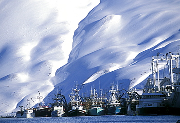 A variety of fishing boats are tied up in Dutch Harbor, Alaska.