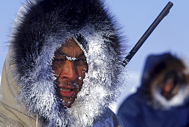 Portrait of Inuit hunter, Daniel Quanatsiag, during polar bear hunt, Nunavut, Canada.