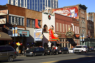 Lower Broadway in Nashville, TN with its mix of touristy country music related attractions juxtaposed with a booming commercial