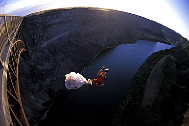 A BASE jumper upside down after jumping off of a bridge in Twin Falls, Idaho (Wide Angle Lens).