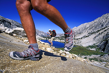 Legs and backpacker in Eastern Sierra Nevada mountains, California.