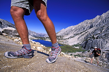 Legs and backpacker in Eastern Sierra Nevada mountains, California.