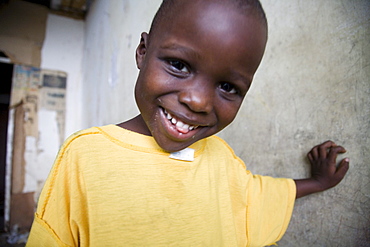 Young Liberian boy in squaters hotel