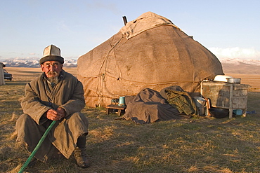 Kyrgyz shepherd in front of his yurt