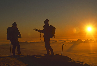 A team preparing the mat_rial for climbing