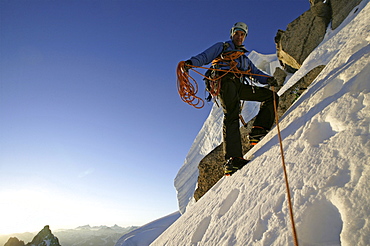 A man ascending a mountain.