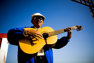 Mariachi guitar player poses for a photo in Tijuana, BC, Mexico.