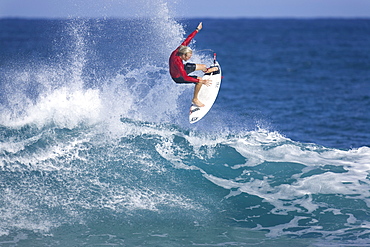 surfer performing an ariel manoeuvre, Hawaii