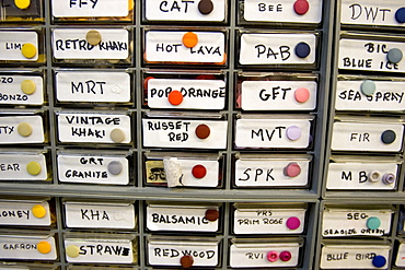 Clothing repair supplies in drawers in a clothing distribution center in Reno, Nevada.