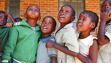 Children wait in line for lunch at a daycare center for children of parents with AIDS near Gaborone, Botswana.