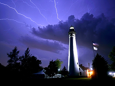 Lightning streaks across the sky near the Wind Point Lighthouse in Racine, Wis. It is one of the tallest and oldest that is still active on the Great Lakes.