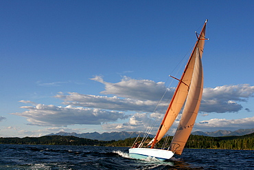 Guest at The Flathead Lake Lodge near Bigfork, Montana sail on the Questa a 51' Q-Class racing boat build in 1928.