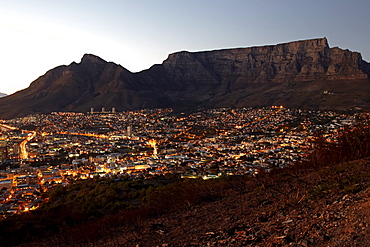 A view of Cape Town and Table Mountain from Signal Hill just before sunrise. South Africa.