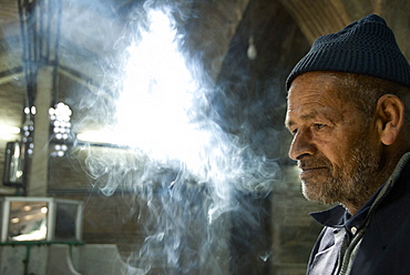 Portrait of a senior man smoking, Isfahan, Iran