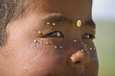 Close up of a nomad Kid, Irkestan pass, Kyrgyzstan