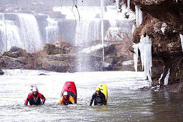 Three kayakers in a bow stall in Tennessee.