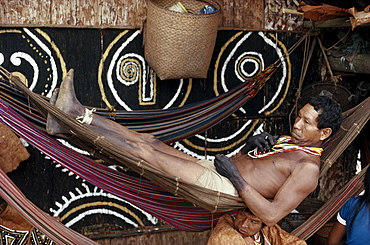 Mukuna man relaxes on hammock.  Eastern Colombia Amazon, Vaupes region.