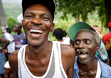 Two pilgrims laugh during the festivities surrounding the Saut D'eau voodoo pilgrimage in Haiti.