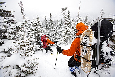 Two men hiking through the snow on Mt. Washington.