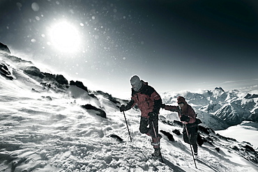 Two men walking on Elbrus Mountain during Elbrus Race, the highest race in Europe.