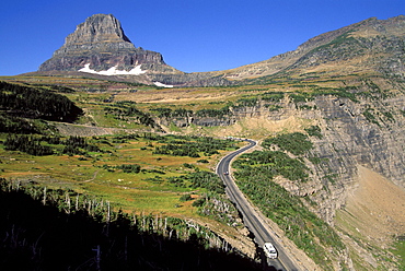 A van descends a mountain pass, Glacier National Park, MT