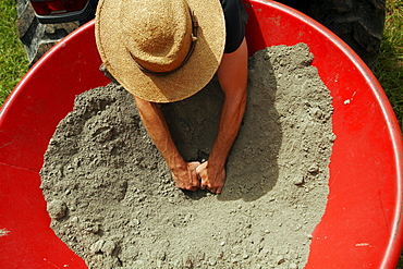 Worker spread lime over fields at the farm at Circle Acres.