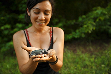 Danielle examines baby animals found on the farm at Circle Acres