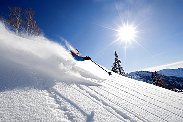 A male skier skis fresh powder in the Wasatch Backcountry, Utah.