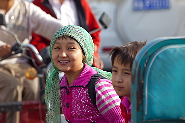 Young girls smiling in Hotan, Xinjiang, China.