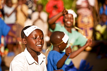 Village girls dancing to welcome an artist and activist back to Rugerero.