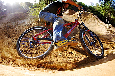 A man carving a berm on a mountain bike