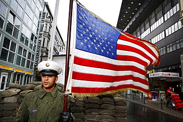 Pictured is a member of the association: "Geschichte lebendig vermitteln" (bringing history to life) at Checkpoint Charlie (former crossing point of the Allied forces), who is representing an American guard, Berlin, October 01 2009.