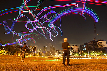 Members of the Singapore Night Flyer Kite club light up the evening sky with remote controlled kites adorned with colorful LED lighting.