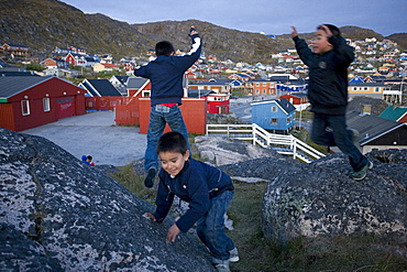 Kids playing with toy guns in Qaqortoq, Greenland.