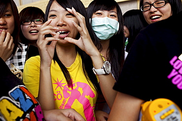 Teenage girls take a break from dancing at the National Concert Hall near Chiang Kai-Shek Memorial Hall in Taipei, Taiwan, October 23, 2010.