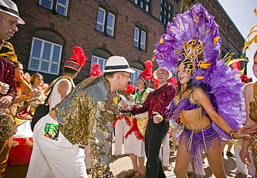 Two dancers dance during the Whitsun Carnival in Copenhagen, Denmark.