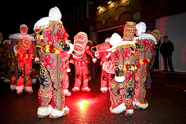 Gilles dance around a fire to the sound of the drums at the annual Carnival of Binche, Belgium.