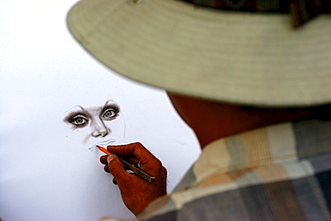 St Petersburg- portraitist drawing a face.