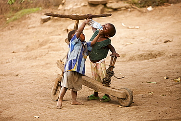 Young Congolese Boys Sharing Water