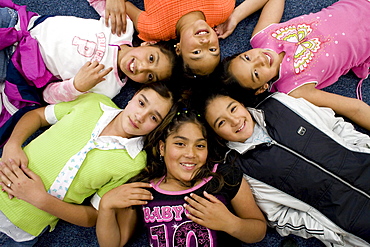 Palmira Gonzalez-Jiminez is surrounded by her best buddies at Harrington Elementary School in Denver, Colorado. A man tried to abduct Palmira in a nearby park last month. Her friends all ran to her aid hitting and kicking the man. The girls are clockwise starting with Palmira Gonzalez-Jiminez in center (Baby GIrl shirt), Lorena Luna,  Crystal Palacios,  Irma Belmontes, Melina Sandoval,  Sandra Ibarra.