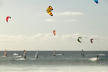 Kiteboarding, windsurfing, and surfing all on the same point break. Punta Preta (Black Point) on the island of Sal, Cape Verde.