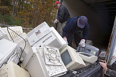 Workers load computers dropped off for recycling in Brockton, Massachusetts.