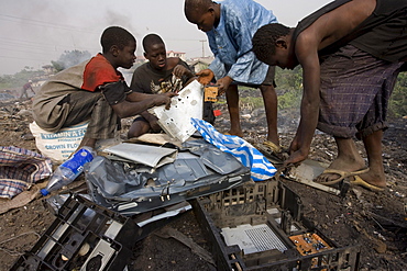 Alaba Market, Lagos Nigeria. Many of the computers here are second hand and shipped from Asia, the USA or Europe for reuse. The small shop dealers buy electronics from the containers and are very good at repairing the goods for sale. Only when material has no value is it sent to nearby dumps. Some kids look through this and try to salvage some coppers wires or aluminum pieces.