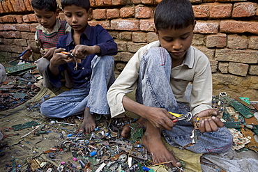 A village named Muftaffabad Loni on the outskirts of New Delhi, India that specializes in recycling circuit boards from electronics. The boards are taken out of electronics in other areas of New Delhi. Some of the boards are burned, some are dipped in sulfuric acid to get the metals separated from the plastics.