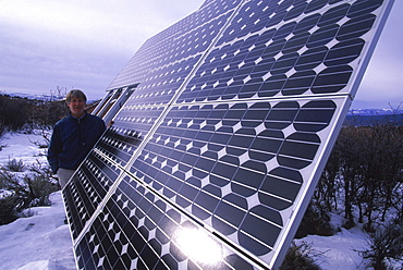 Randy Udall of CORE monitors one of his solar panels.